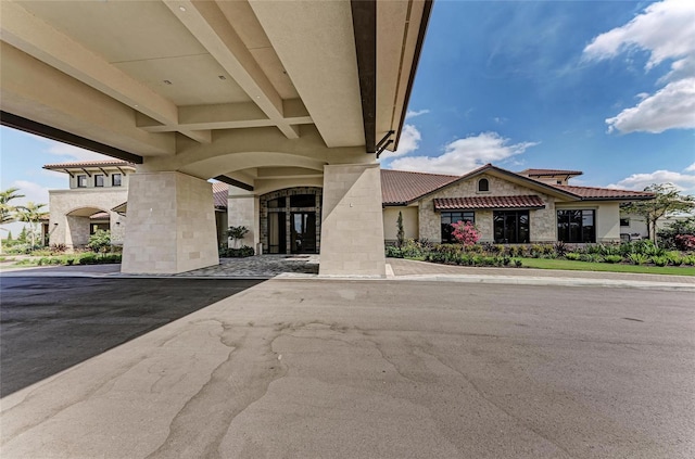 view of front of house featuring stone siding and stucco siding