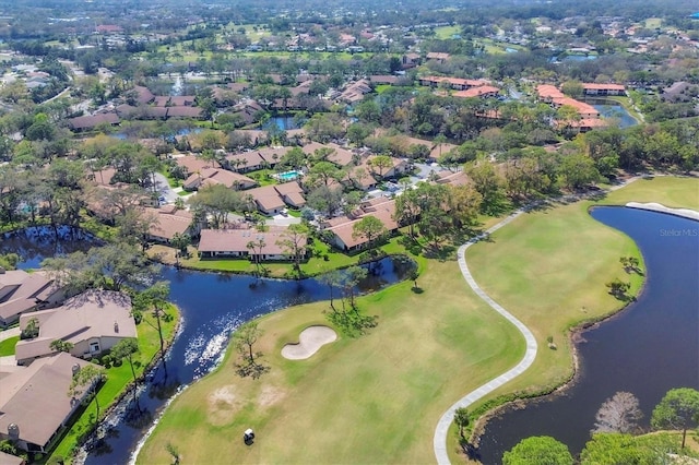 aerial view with a water view, view of golf course, and a residential view