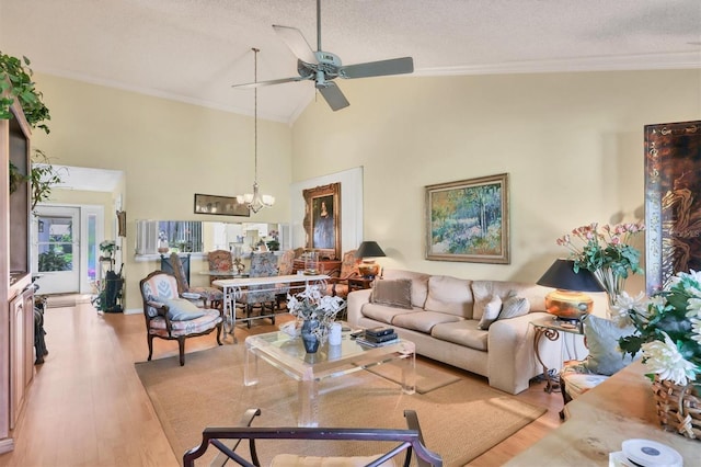 living area featuring a textured ceiling, high vaulted ceiling, wood finished floors, and crown molding