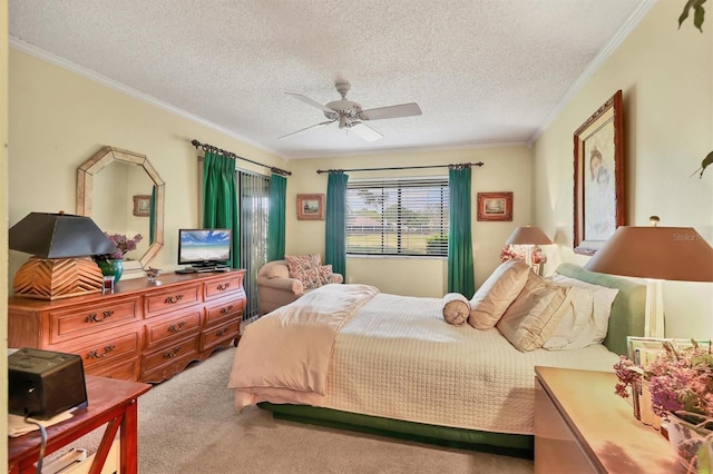 bedroom featuring a ceiling fan, carpet flooring, crown molding, and a textured ceiling