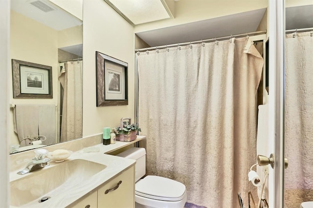 full bathroom featuring visible vents, vanity, and toilet