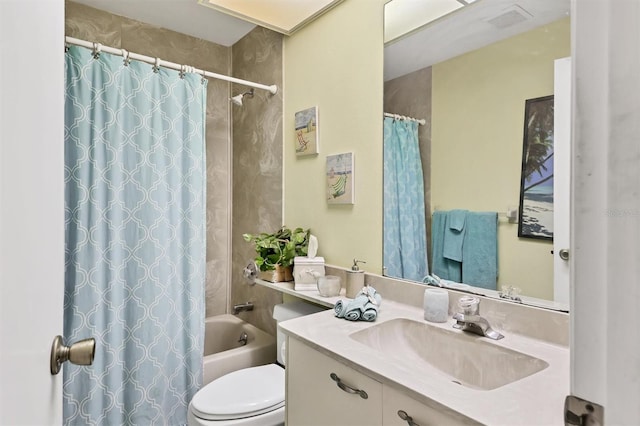 bathroom featuring visible vents, vanity, toilet, and shower / tub combo with curtain