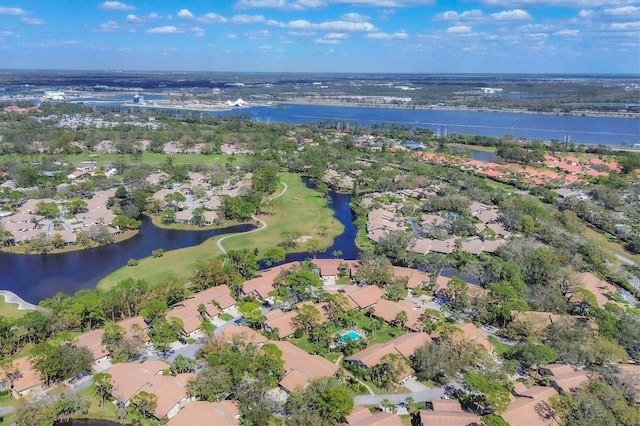 birds eye view of property with a water view and a residential view