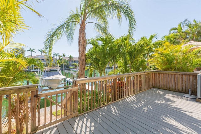 deck with a dock and boat lift