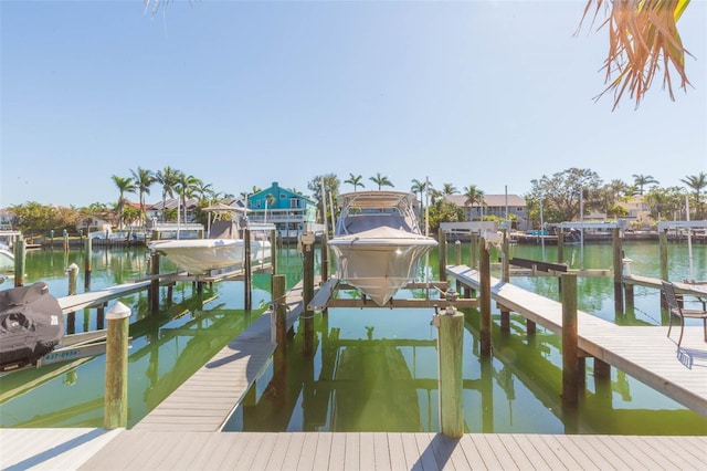 view of dock with a water view and boat lift