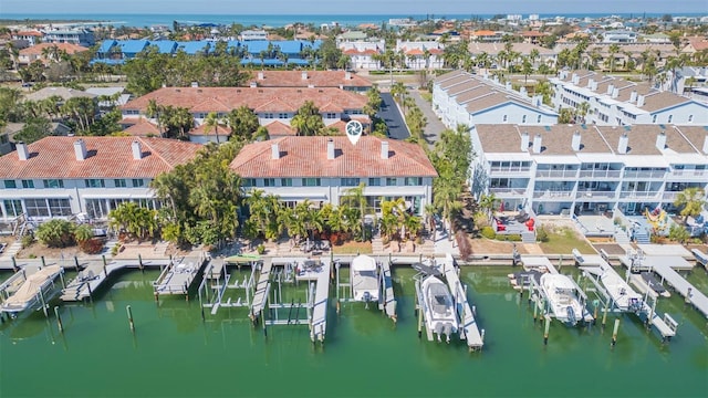 bird's eye view with a water view and a residential view