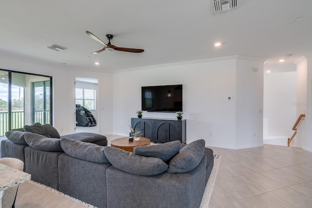 living area featuring ornamental molding, visible vents, and recessed lighting