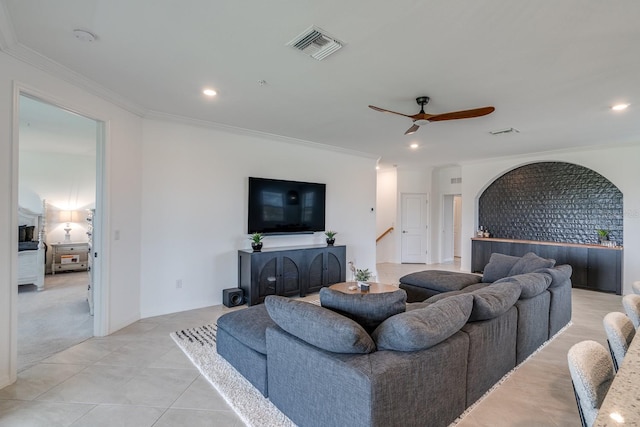 living area with ornamental molding, recessed lighting, visible vents, and a ceiling fan