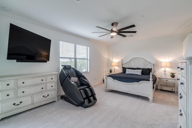 bedroom with ornamental molding, light carpet, baseboards, and a ceiling fan