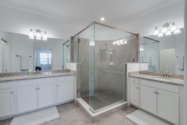 bathroom with ornamental molding, a sink, and a shower stall