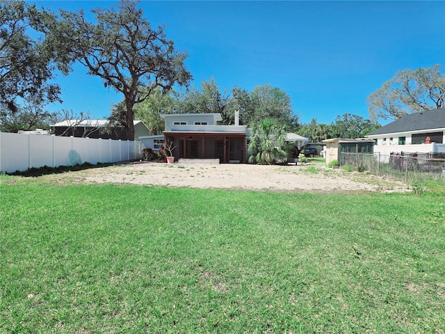 view of yard with a fenced backyard