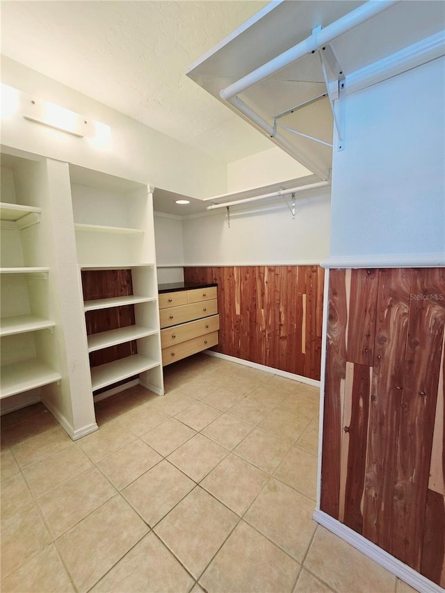 walk in closet featuring light tile patterned floors