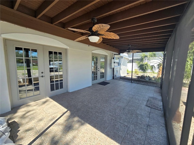 view of patio with french doors and a ceiling fan