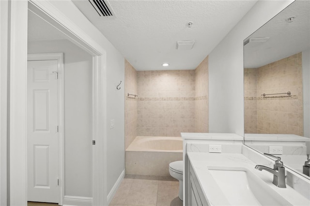 bathroom with visible vents, toilet, tile patterned floors, a textured ceiling, and vanity