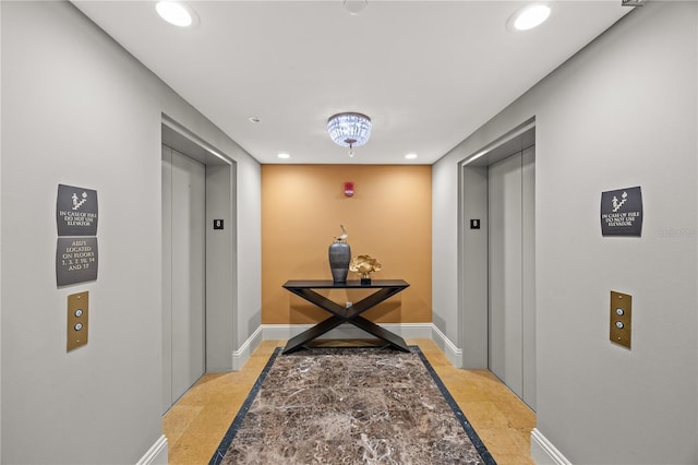 hallway featuring baseboards, elevator, and recessed lighting