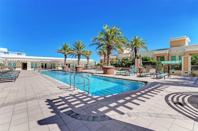 community pool with a patio area