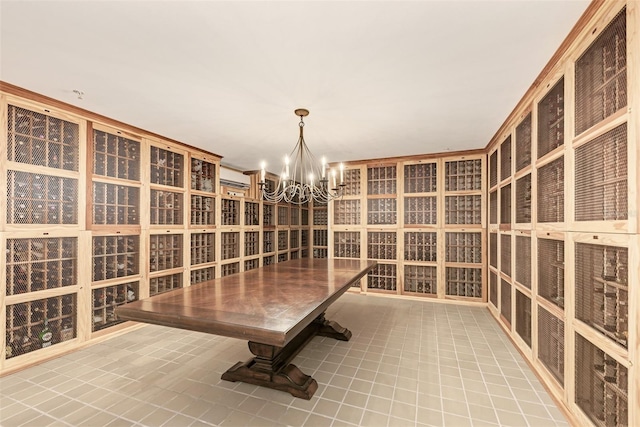 wine cellar with light tile patterned flooring and a notable chandelier