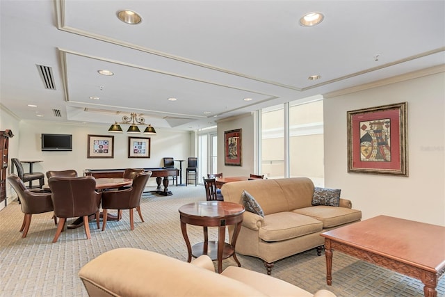 living room with ornamental molding, recessed lighting, light carpet, and visible vents