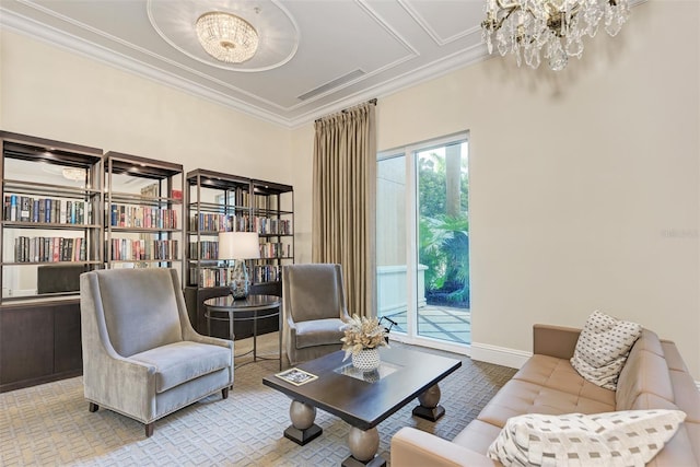 living area with an inviting chandelier, baseboards, visible vents, and crown molding