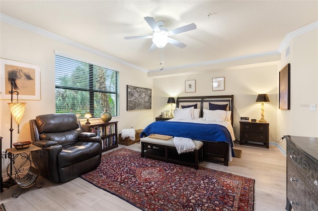 bedroom with light wood-type flooring, visible vents, ornamental molding, and baseboards