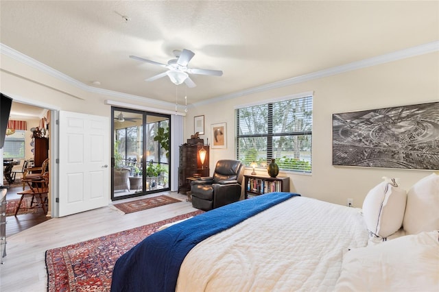 bedroom with ornamental molding, access to outside, a ceiling fan, and wood finished floors