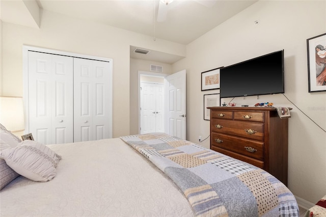 bedroom with a ceiling fan, visible vents, and a closet