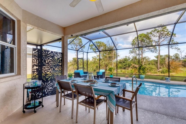 exterior space featuring a lanai, an outdoor pool, ceiling fan, and outdoor dining space