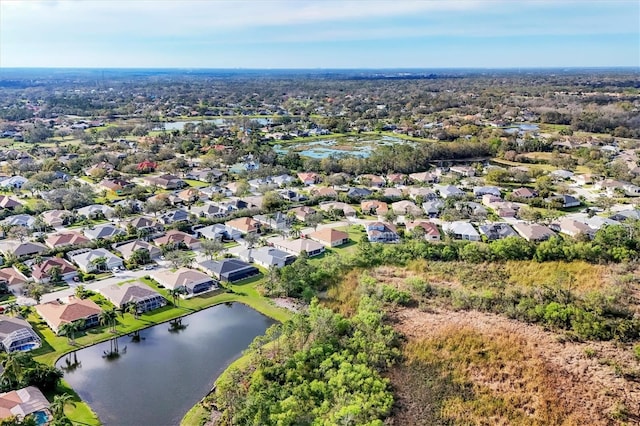 birds eye view of property with a residential view and a water view