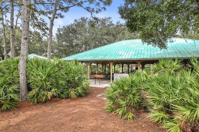 view of property's community with a gazebo and a patio