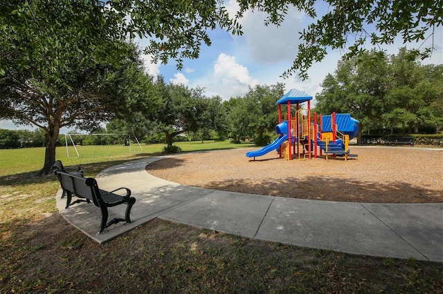 community jungle gym with a yard