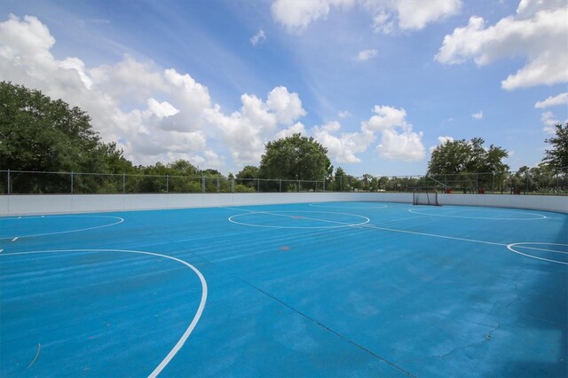 view of sport court with fence