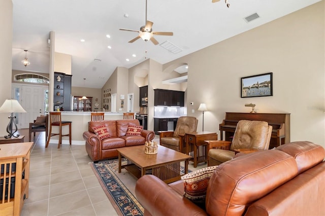 living room featuring light tile patterned floors, high vaulted ceiling, recessed lighting, visible vents, and a ceiling fan