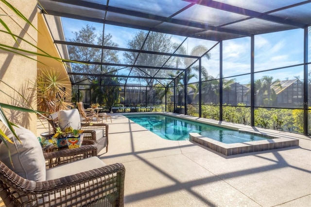 view of swimming pool with a lanai, a patio area, and a pool with connected hot tub