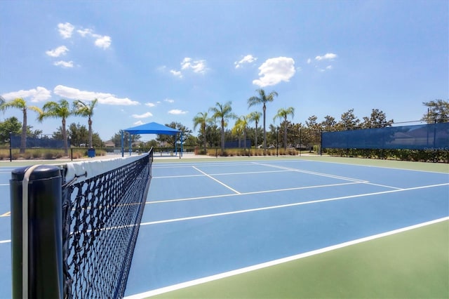 view of tennis court with fence