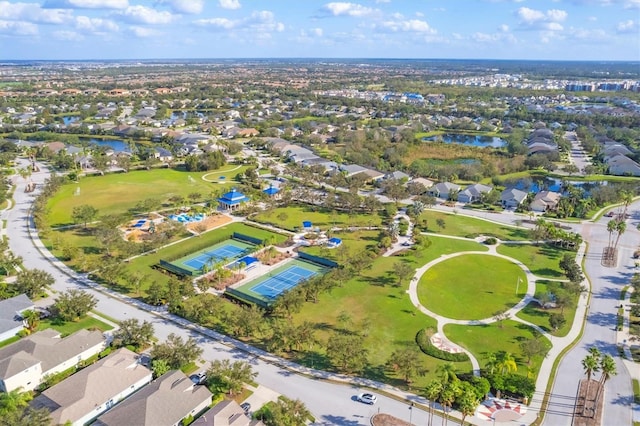 birds eye view of property featuring a water view and a residential view