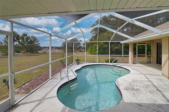 outdoor pool featuring a lanai, a yard, and a patio