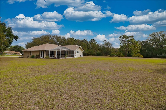 view of yard featuring a sunroom