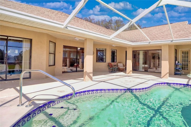 pool with a patio area and a lanai