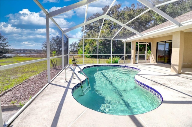 outdoor pool with a patio and a lanai