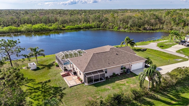 bird's eye view with a water view and a view of trees