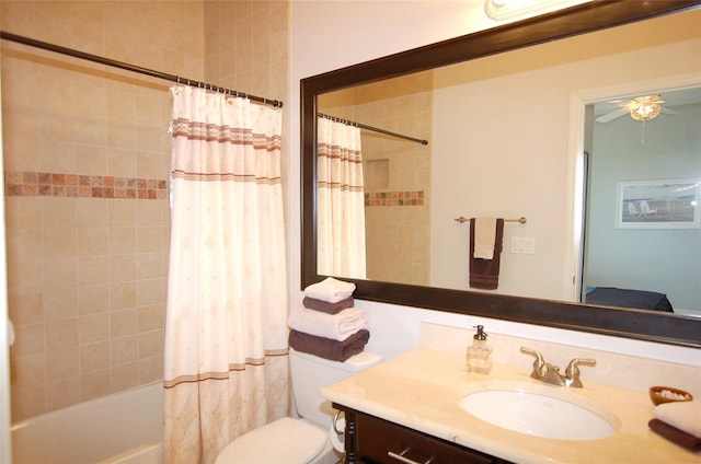 full bathroom featuring toilet, ceiling fan, shower / bath combination with curtain, and vanity