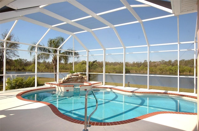 view of pool featuring a water view, glass enclosure, a pool with connected hot tub, and a patio