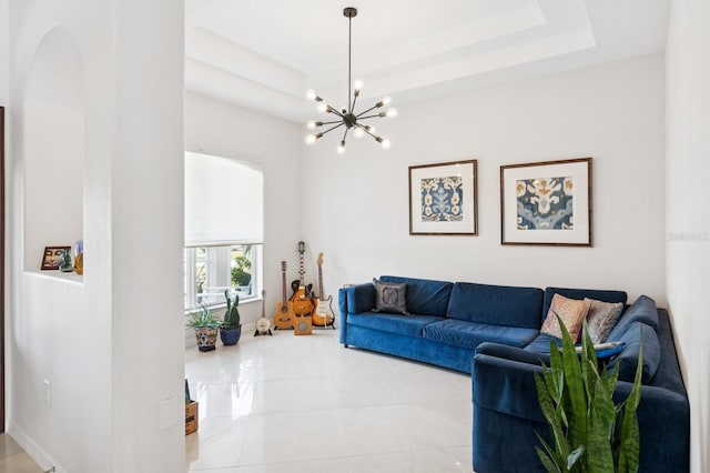 living area featuring a tray ceiling, a notable chandelier, baseboards, and light tile patterned floors