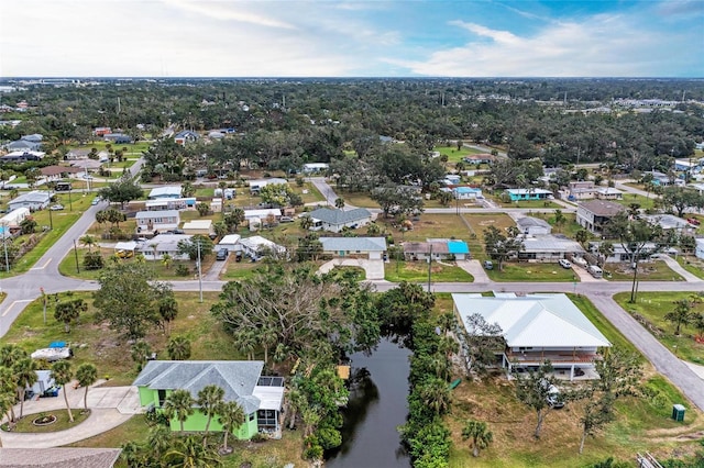 birds eye view of property featuring a water view and a residential view