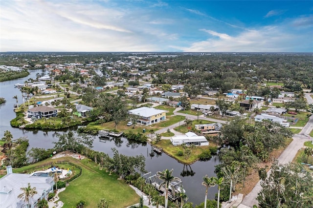 bird's eye view featuring a water view and a residential view