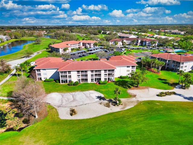 bird's eye view featuring golf course view and a water view