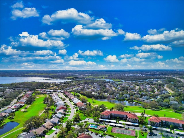 aerial view with a water view and view of golf course