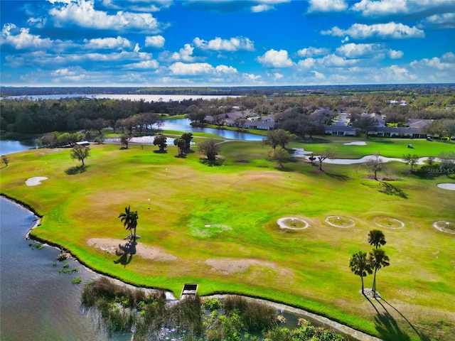 bird's eye view with view of golf course and a water view