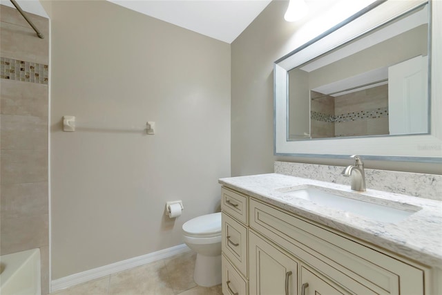 bathroom featuring vanity, tile patterned flooring, toilet, and baseboards