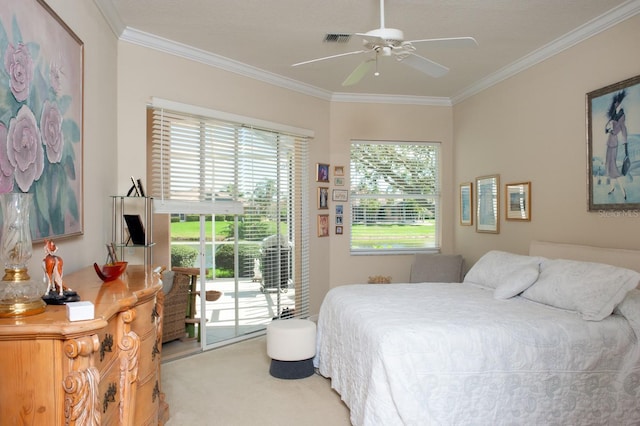 carpeted bedroom with ornamental molding, access to outside, visible vents, and a ceiling fan